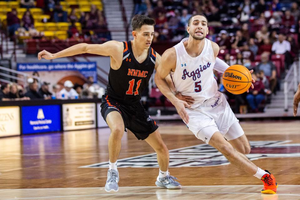 NMSU guard Kyle Feit takes the ball to the net during a mens college basketball game on Sunday, Dec. 18, 2022, at Pan American Center.