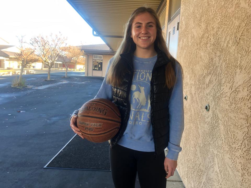 West Valley senior  guard Kayla Wiley holds a basketball outside her school on Tuesday, Dec. 6, 2022.