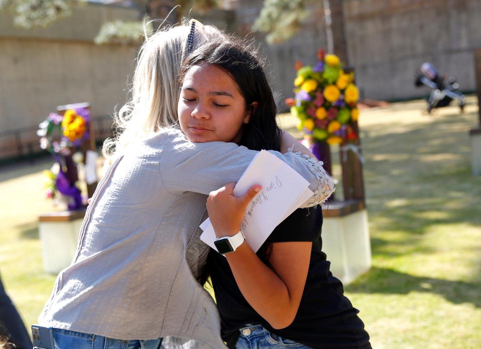 Little Axe students Yanely Martinez Hernandez hugs Aren Almon, the mom of Baylee Almon, following the 2023 Remembrance Ceremony at the Oklahoma City National Memorial & Museum in Oklahoma City, Wednesday, April, 19, 2023. Hernandez left a note for Baylee on her chair.