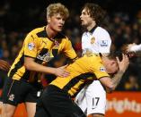 Cambridge United's Josh Coulson (R) reacts after missing a chance to score during their English FA Cup 4th round soccer match against Manchester United at The Abbey Stadium in Cambridge, eastern England January 23, 2015. REUTERS/Andrew Winning (BRITAIN - Tags: SPORT SOCCER)