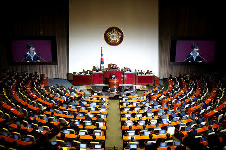 South Korean President Park Geun-hye delivers her speech on the 2017 budget bill during a plenary session at the National Assembly in Seoul, South Korea, October 24, 2016. REUTERS/Kim Hong-Ji