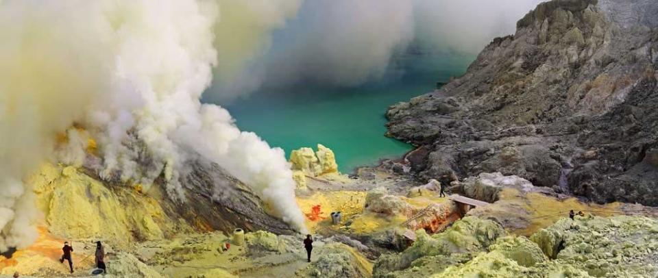 Indonesian sulphur miners spend 12 hours a day surrounded by acid-filled lakes and toxic smoke. They are paid just £3 and wear limited safety equipment (CATERS)