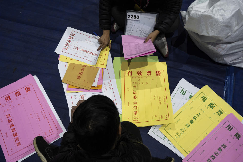 Staff prepare materials for polling booth in New Taipei, Taiwan on Friday, Jan. 12, 2024 ahead of the presidential election on Saturday. (AP Photo/Louise Delmotte)