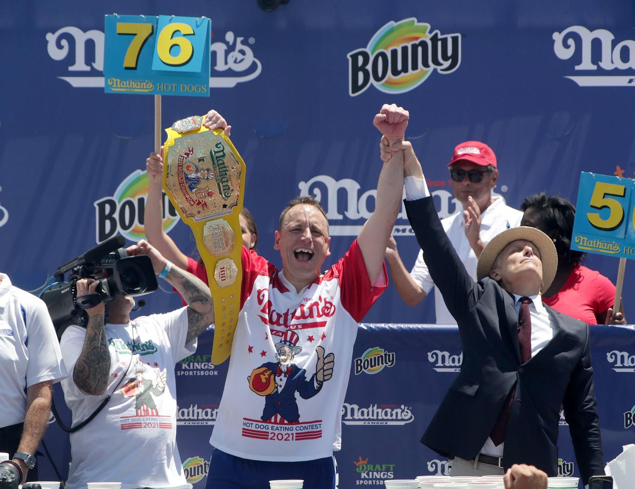 Competitive eater Joey Chestnut celebrates winning the Nathan's Fourth of July Hot Dog Eating Contest in Coney Island. 