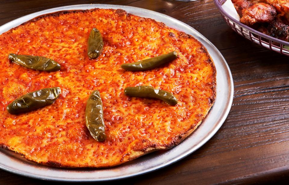 At Riko's, what makes the "hot oil" pizza hot is a signature blend of stinger pepper-infused.