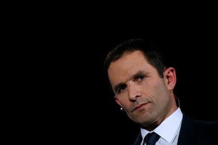 Benoit Hamon, French Socialist party candidate in their first-round presidential primary election, attends a political rally as he campaigns in Paris, France, January 18, 2017. REUTERS/Jacky Naegelen