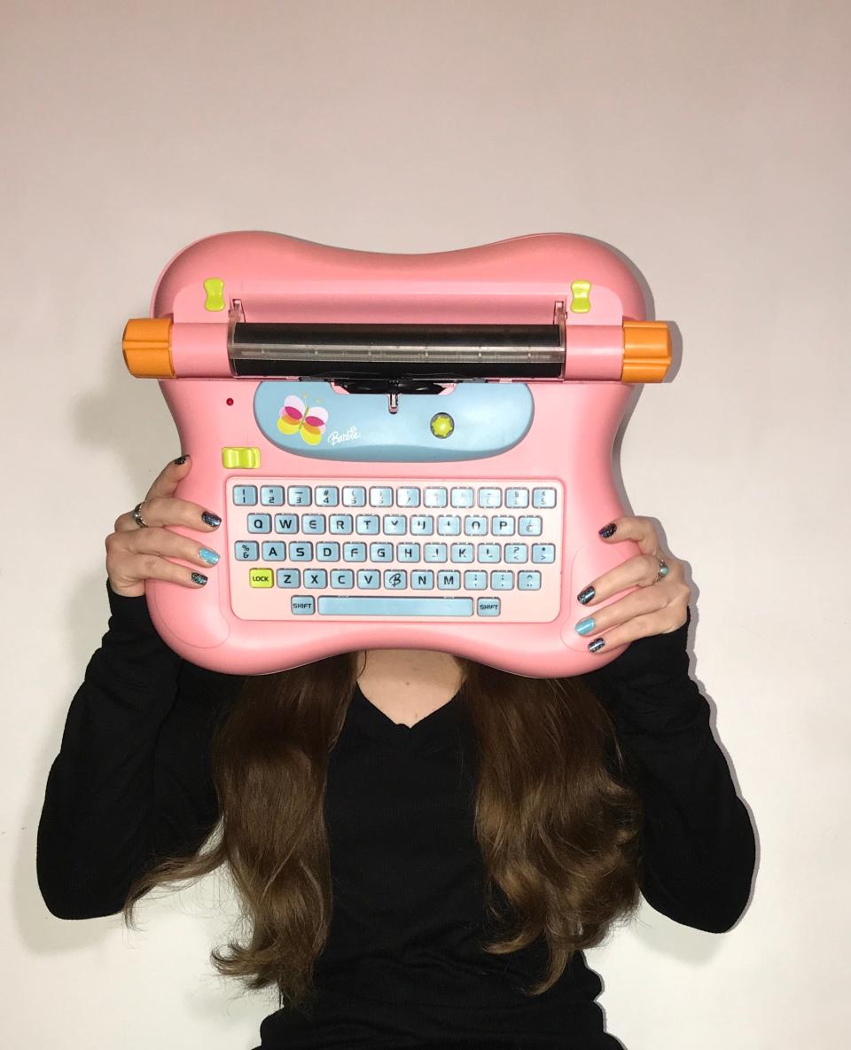 Sarah Everett with one of her Barbie typewriters