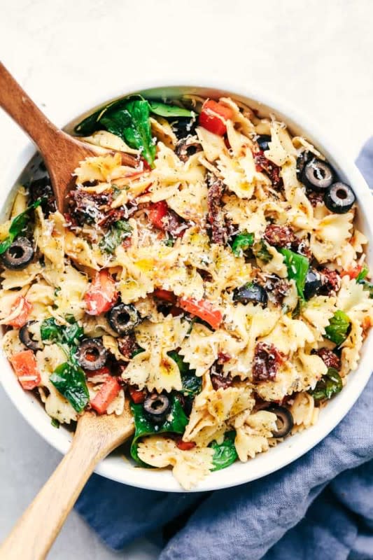 <p>The Recipe Critic</p><p>This Tuscan pasta salad recipe is an easy pasta salad with sun dried tomatoes, peppers spinach, and olives tossed in a tangy dressing. This pasta salad is perfect for your next potluck!</p><p><strong>Get the recipe: <a href="https://therecipecritic.com/tuscan-pasta-salad/" rel="nofollow noopener" target="_blank" data-ylk="slk:Tuscan Pasta Salad;elm:context_link;itc:0;sec:content-canvas" class="link ">Tuscan Pasta Salad</a></strong></p>