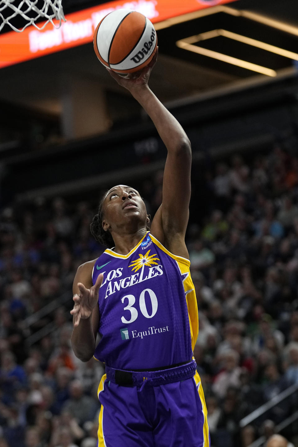 Los Angeles Sparks forward Nneka Ogwumike goes up to shoot during the first half of a WNBA basketball game against the Minnesota Lynx, Sunday, June 11, 2023, in Minneapolis. (AP Photo/Abbie Parr)