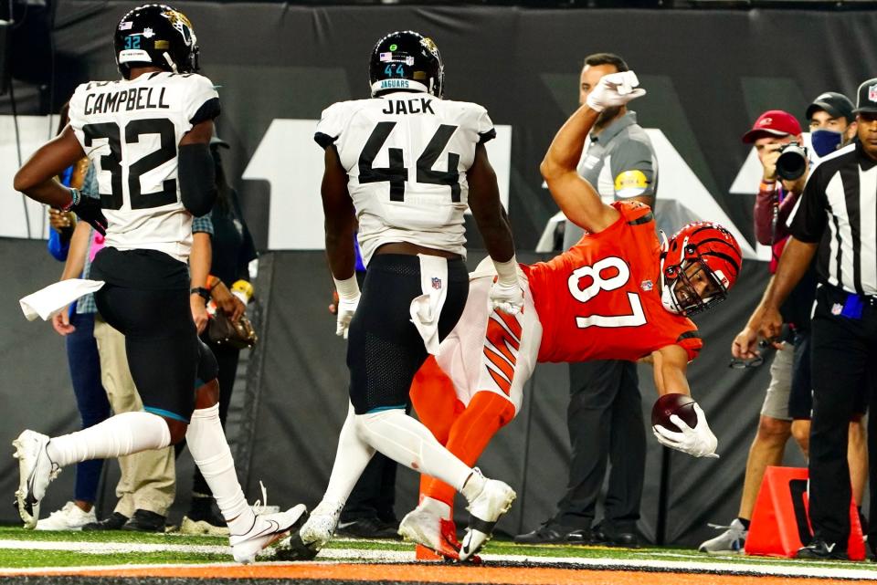 Cincinnati Bengals tight end C.J. Uzomah scores a touchdown early in the third quarter Thursday night against the Jacksonville Jaguars at Paul Brown Stadium.