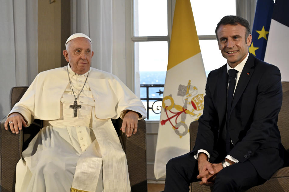 Pope Francis meets French President Emmanuel Macron at the Palais du Pharo, in Marseille, France, Saturday, Sept. 23, 2023. Francis, during a two-day visit, will join Catholic bishops from the Mediterranean region on discussions that will largely focus on migration. (Andreas Solaro/AFP via AP, Pool)
