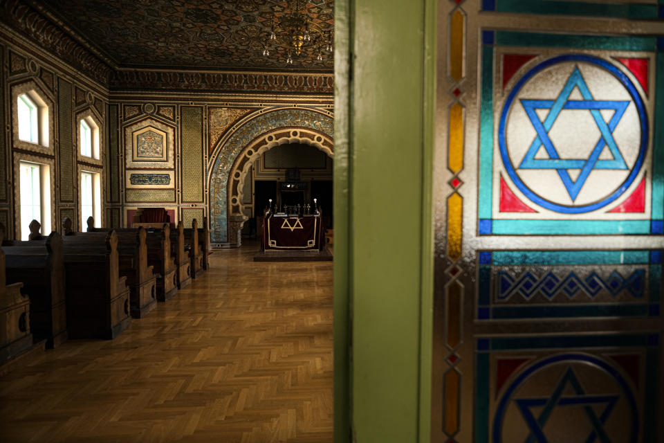 In this Thursday, April 9, 2020 photo the synagogue in Sarajevo, Bosnia, is deserted as worshipers stay away due to the national lockdown the authorities have imposed attempting to limit the spread of the new coronavirus. (AP Photo/Kemal Softic)