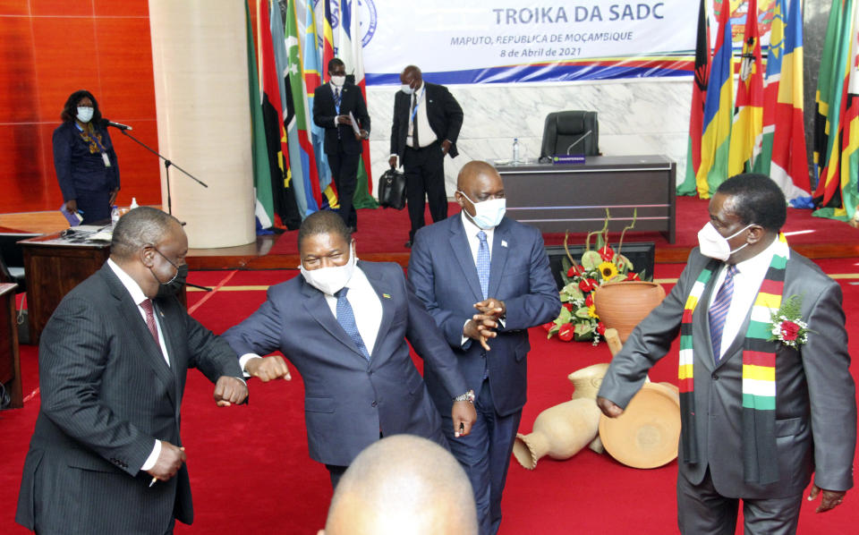 Southern African leaders greet each other during a meeting in Mozambique's capital Maputo, Thursday, April 8, 2021. Leaders met to discuss ways to respond to the violence by Islamic extremist rebels in the country's northern Cabo Delgado province where thousands of people have been killed and displaced. (AP Photo/Ferhat Momade)