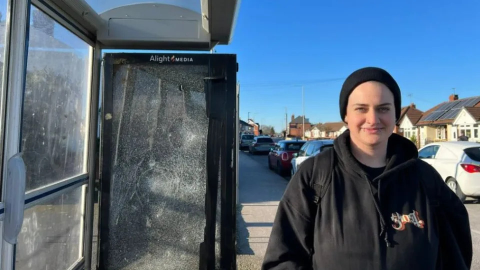 Anna Lowe at a bus stop