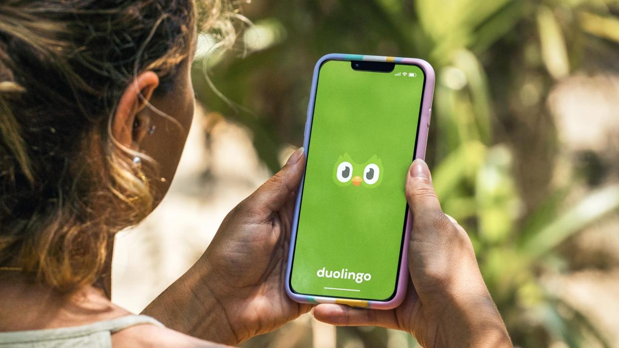  A person using the Duolingo app on their smartphone 