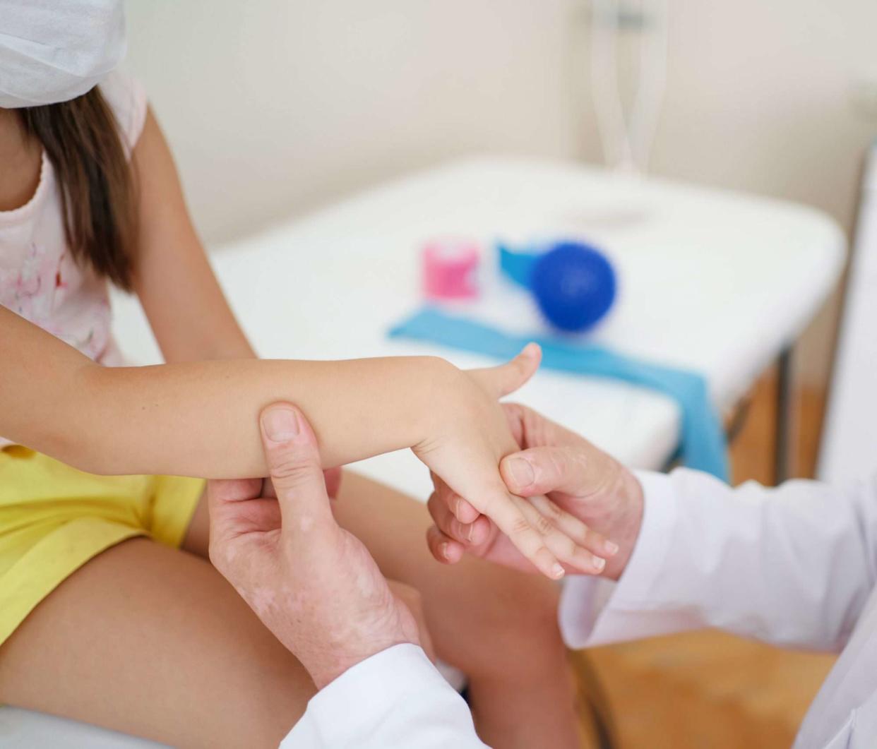 An image of a young girl at the doctor's office.