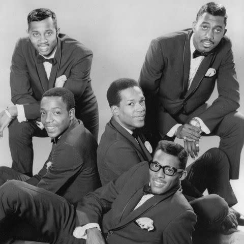 <p>Hulton Archive/Getty</p> The Temptations photographed in 1965, Otis Williams posing in the top right