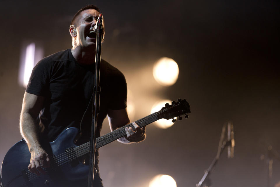 In this March 27, 2014 photo, Trent Reznor of Nine Inch Nails performs at the Vive Latino music festival in Mexico City, Mexico. Reznor says he feels “a fresh new start” for Nine Inch Nails after the band’s latest album and world tour. (AP Photo/Rebecca Blackwell)