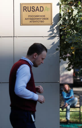 A man walks past a sign outside the office of Russian Anti-Doping Agency (RUSADA) in Moscow, Russia September 20, 2018. REUTERS/Maxim Shemetov