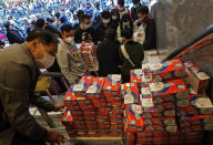 FILE - In this Feb. 5, 2020, file photo, citizens line up to buy face masks in Hong Kong. Fear of the spreading coronavirus has led to a global run on sales of face masks despite medical experts' advice that most people who aren't sick don't need to wear them. (AP Photo/Vincent Yu, File)