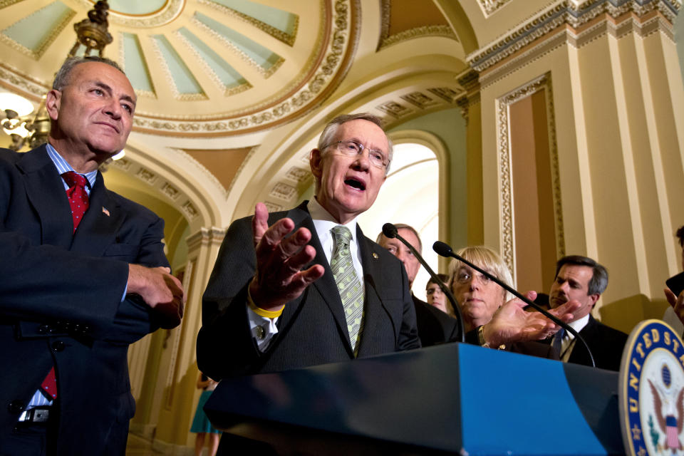 FILE - Senate Majority Leader Harry Reid, D-Nev., center, talks about the yearlong tax cut extension bill Democrats passed by a near party-line 51-48 vote, at the Capitol in Washington, on July 25, 2012. From back left are Sen. Charles Schumer, D-N.Y., Sen. Richard Durbin, D-Ill., and Sen. Patty Murray, D-Wash. Reid, the former Senate majority leader and Nevada’s longest-serving member of Congress, has died. He was 82. (AP Photo/J. Scott Applewhite, File)