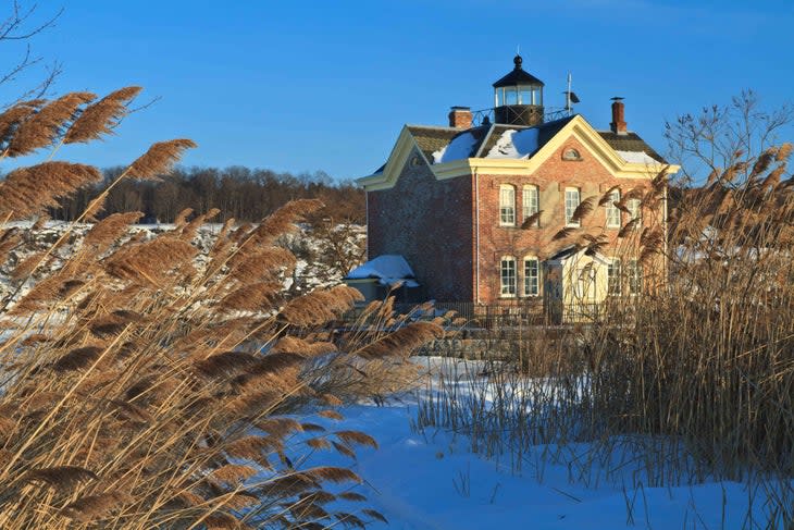 <span class="article__caption">Saugerties Lighthouse on the Hudson River, in upstate New York, offers overnight accommodation.</span> It is shown here in winter. (Photo: Lightphoto/Getty)
