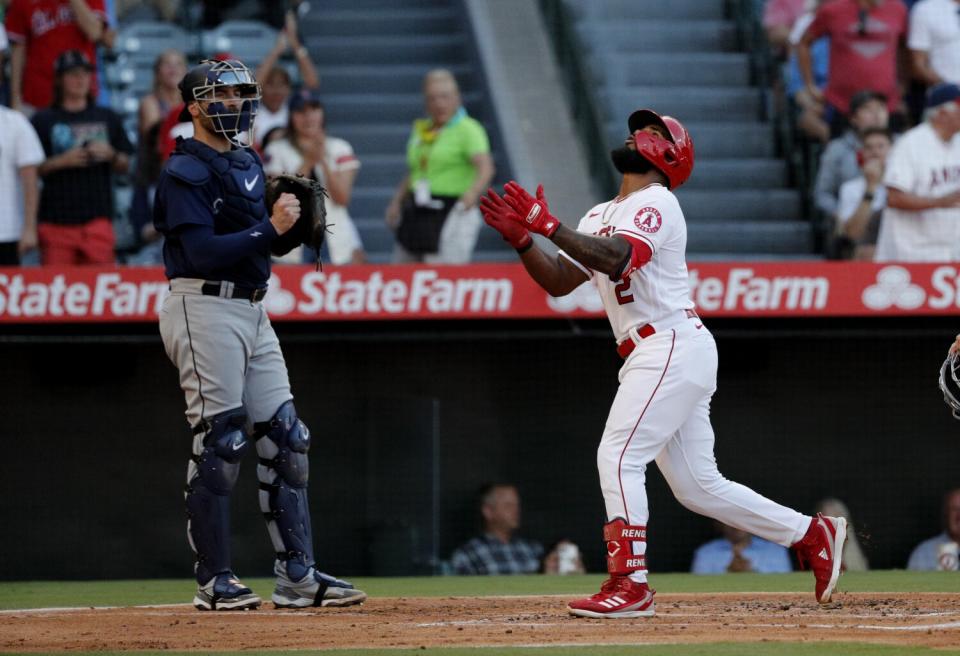 Angels second baseman Luis Rengifo looks skyward as he crosses the plate.