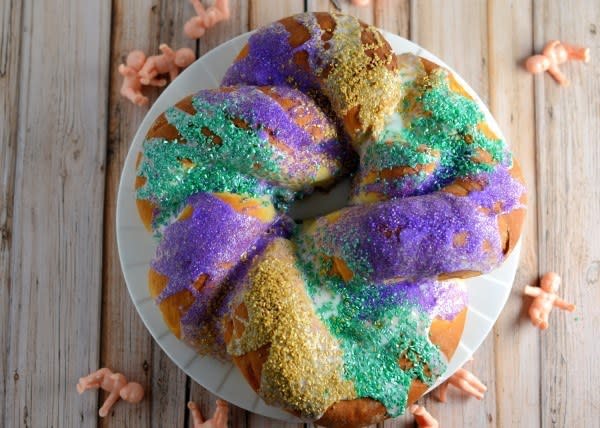 <p>No Mardi Gras celebration would be complete without king cake. <a href="http://www.savoryexperiments.com/" rel="nofollow noopener" target="_blank" data-ylk="slk:Savory Experiment's;elm:context_link;itc:0;sec:content-canvas" class="link "><strong>Savory Experiment's</strong></a> riff on this traditional ring of dough has a sweet, nutty filling and a light glaze. Just don't forget to insert the plastic baby after baking for good luck!<br><br><a href="http://www.savoryexperiments.com/mardi-gras-king-cake/" rel="nofollow noopener" target="_blank" data-ylk="slk:For the Mardi Gras King Cake recipe, click here.;elm:context_link;itc:0;sec:content-canvas" class="link "><strong>For the Mardi Gras King Cake recipe, click here.</strong></a></p>