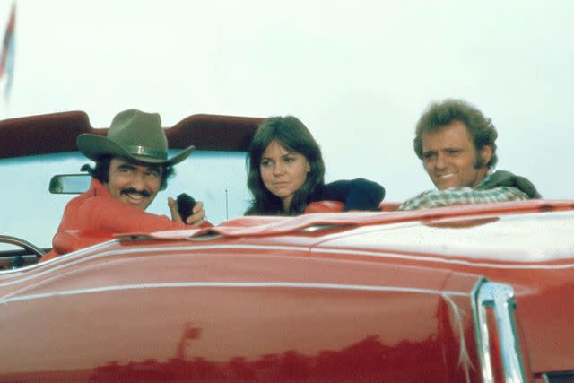 Universal/Kobal/Shutterstock Burt Reynolds, Sally Field and Jerry Reed <i>Smokey and the Bandit</i>, 1977.