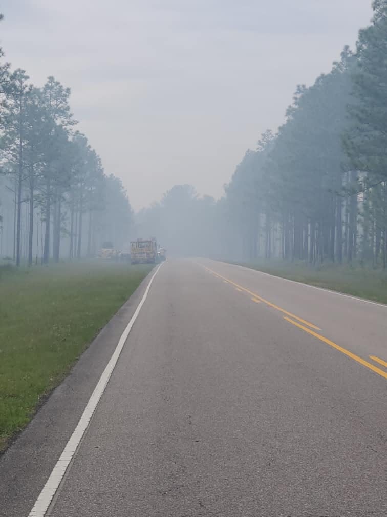 A stretch of N.C. 211 remains closed as the N.C. Forest Services works to put out a fire that's spread to nearly 600 acres of swampy land north of Supply.