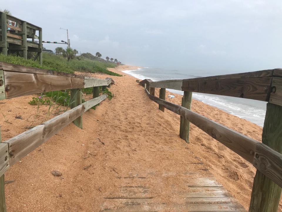 Sand has covered up a portion of a wooden ramp leading to the beach just north of the pier in Flagler Beach. Recent erosion has moved sand around on the beach and taken some sand into the ocean.