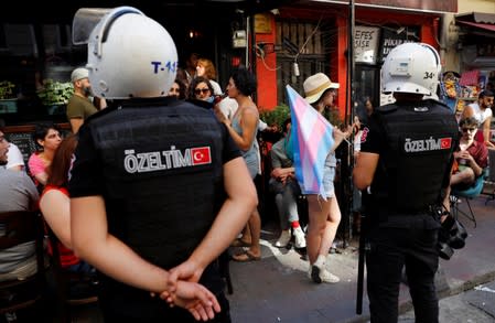 Riot police stand guard in front of a bar to prevent LGBT rights activists to gather for a pride parade, which was banned by the governorship, in Istanbul