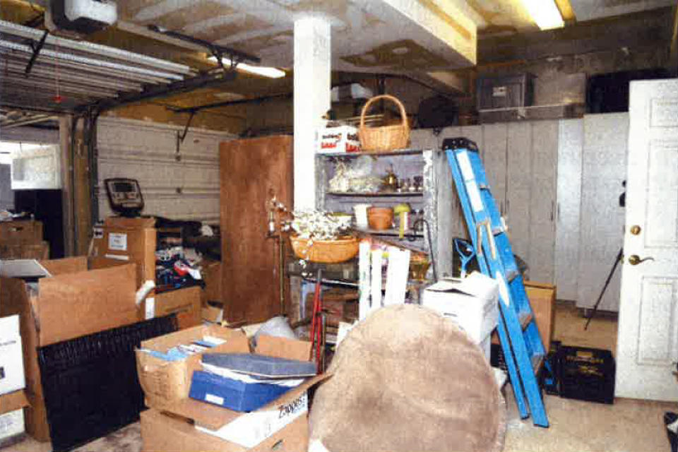 This image, contained in the report from special counsel Robert Hur, shows the cluttered garage of President Joe Biden in Wilmington, Del., during a search by the FBI on Dec. 21, 2022. (Justice Department via AP)