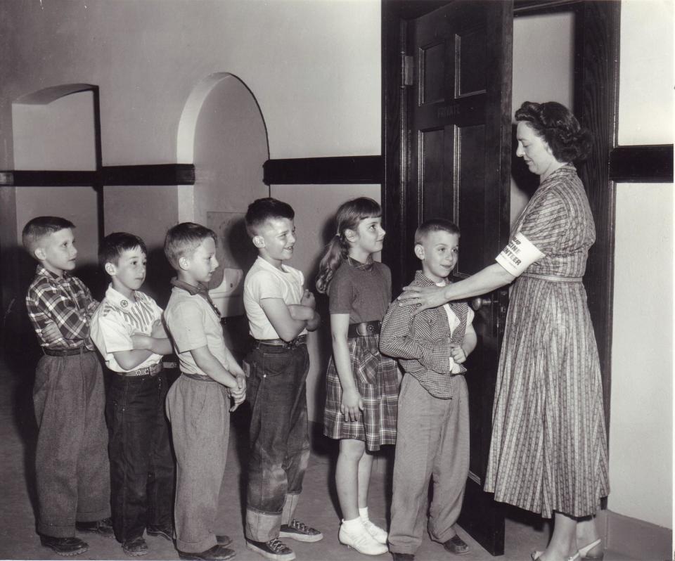 Children line up to get their polio vaccines at the Woodbury Avenue School in Huntington, New York, in the 1950s. / Credit: Walter del Toro/Newsday RM via Getty Images