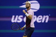 Karen Khachanov, of Russia, reacts after winning a point against Nick Kyrgios, of Australia, during the quarterfinals of the U.S. Open tennis championships, Tuesday, Sept. 6, 2022, in New York. (AP Photo/Charles Krupa)