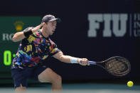 Dominik Koepfer, of Germany, returns a ball from Daniil Medvedev in their men's singles fourth round match at the Miami Open tennis tournament, Tuesday, March 26, 2024, in Miami Gardens, Fla. (AP Photo/Rebecca Blackwell)