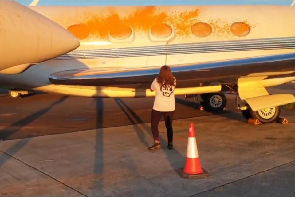 One activist sprayed orange paint over the sides of two parked planes at the airport (Just Stop Oil) (PA Media)