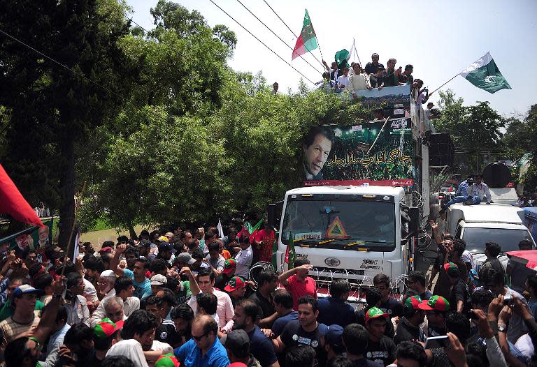 Pakistan cricketer-turned-politician Imran Khan (top-C) heads a protest march against the government from Lahore to Islamabad, in Lahore on August 14, 2014