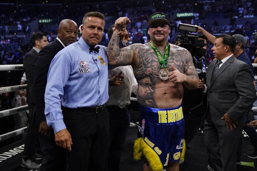 Andy Ruiz, Jr., right, celebrates after winning a WBC world heavyweight title eliminator boxing match against Luis Ortiz, Sunday, Sept. 4, 2022, in Los Angeles. (AP Photo/Ashley Landis)