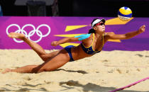 Chen Xue of China dives for a shot during her Women's Beach Volleyball Preliminary match with Xi Zhang of China against Simone Kuhn and Nadine Zumkehr of Switzerland on Day 3 of the London 2012 Olympic Games at Horse Guards Parade on July 30, 2012 in London, England. (Photo by Ryan Pierse/Getty Images)