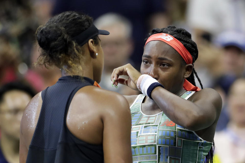 FILE - In this Aug. 31, 2019, file photo, Coco Gauff, right, of the United States, wipes away tears while talking to Naomi Osaka, of Japan, after Osaka defeated Gauff during the third round of the U.S. Open tennis tournament in New York. Two-time Grand Slam champion Naomi Osaka and 16-year-old Coco Gauff could face each other at the U.S. Open again after Thursday’s, Aug. 27, 2020, draw for the Grand Slam tournament set up a possible third-round rematch.(AP Photo/Adam Hunger, File)