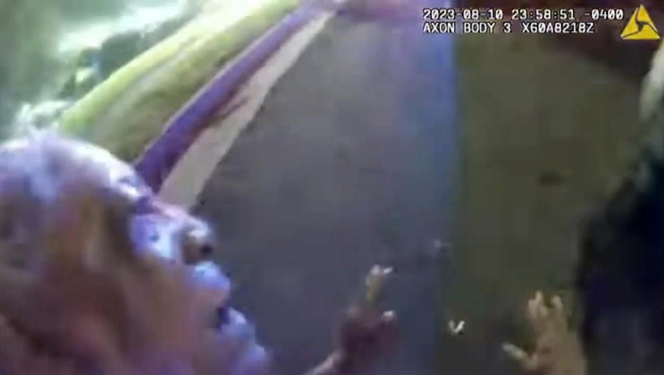 This image from bodycam video provided by the Atlanta Police Department shows Johnny Hollman Sr. struggling with Officer Kiran Kimbrough on Aug. 10, 2023 in Atlanta. The police officer responding to a minor car crash deployed a Taser on the church deacon who disregarded multiple commands to sign a traffic ticket, shocking the man after he repeatedly said he could not breathe, police body camera video released Wednesday, Nov. 22, 2023 shows. Hollman Sr. became unresponsive during his arrest and later died. (Atlanta Police Department via AP)