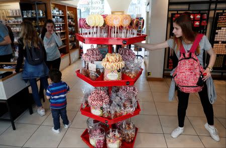 A tourist looks at Candy lollipops on sale in The Tower of London souvenir shop in London, Britain, April 19, 2018. REUTERS/Peter Cziborra