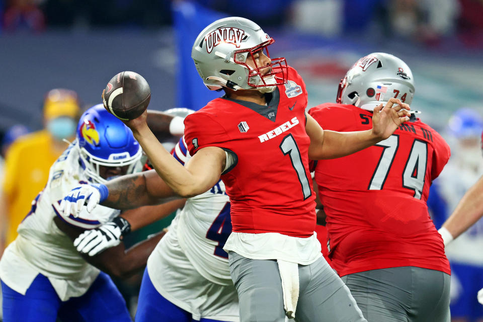 Dec 26, 2023; Phoenix, AZ, USA; UNLV Rebels quarterback Jayden Maiava (1) throws a pass during the second half against the Kansas Jayhawks in the Guaranteed Rate Bowl at Chase Field. Mandatory Credit: Mark J. Rebilas-USA TODAY Sports