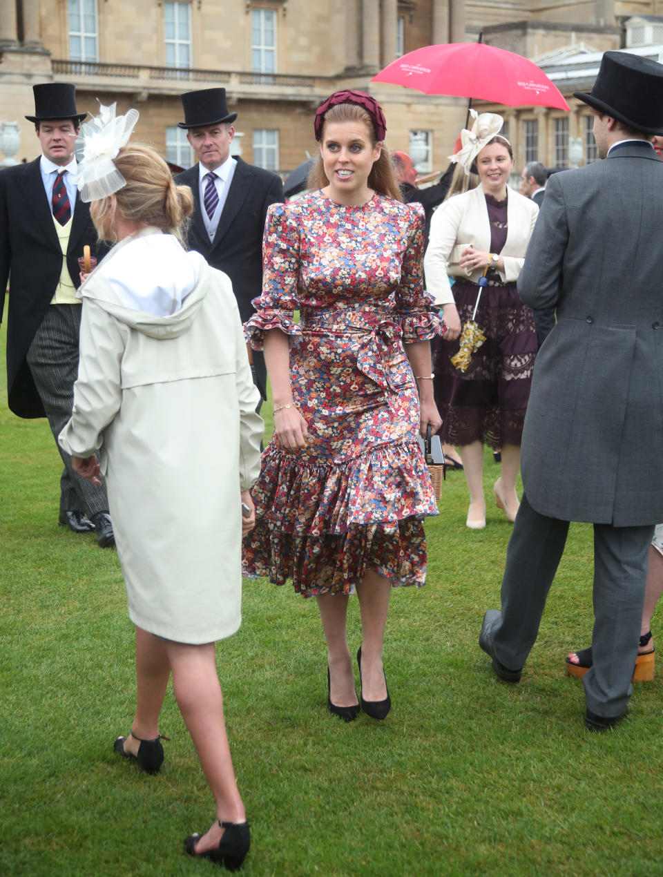 Princess Beatrice wearing The Vampire's Wife and a headband at the Queen's Garden Party in May 29, 2019. [Photo: Getty]