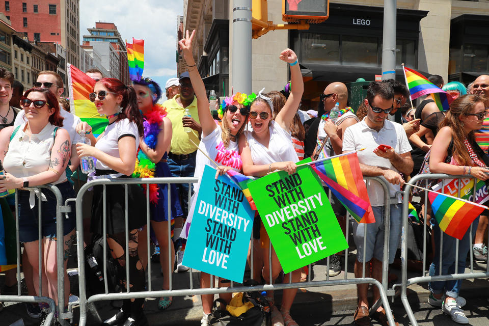 <p>Two young women cheer marchers during the N.Y.C. Pride Parade in New York on June 25, 2017. (Photo: Gordon Donovan/Yahoo News) </p>