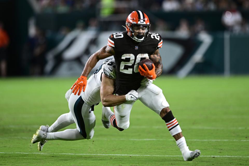 Cleveland Browns cornerback Chris Westry (20) is tackled by Philadelphia Eagles linebacker Ben VanSumeren during the second half of an NFL preseason football game Thursday, Aug. 17, 2023, in Philadelphia. (AP Photo/Derik Hamilton)