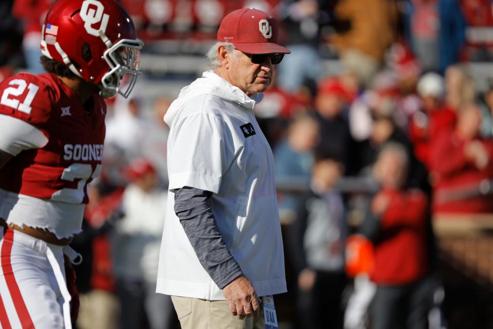 Oklahoma defensive coordinator Ted Roof watches the Sooners warm up before a college football game between the University of Oklahoma Sooners (OU) and the TCU Horned Frogs at Gaylord Family-Oklahoma Memorial Stadium in Norman, Okla., Friday, Nov. 24, 2023. Oklahoma won 69-45.