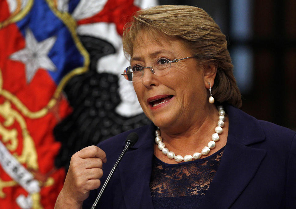 Chile's new President Michelle Bachelet sepaks at the presidential palace La Moneda in Santiago, Chile, Wednesday, March 12, 2014. Bachelet, who led Chile from 2006-2010, was sworn-in as president on Tuesday. (AP Photo/Luis Hidalgo)