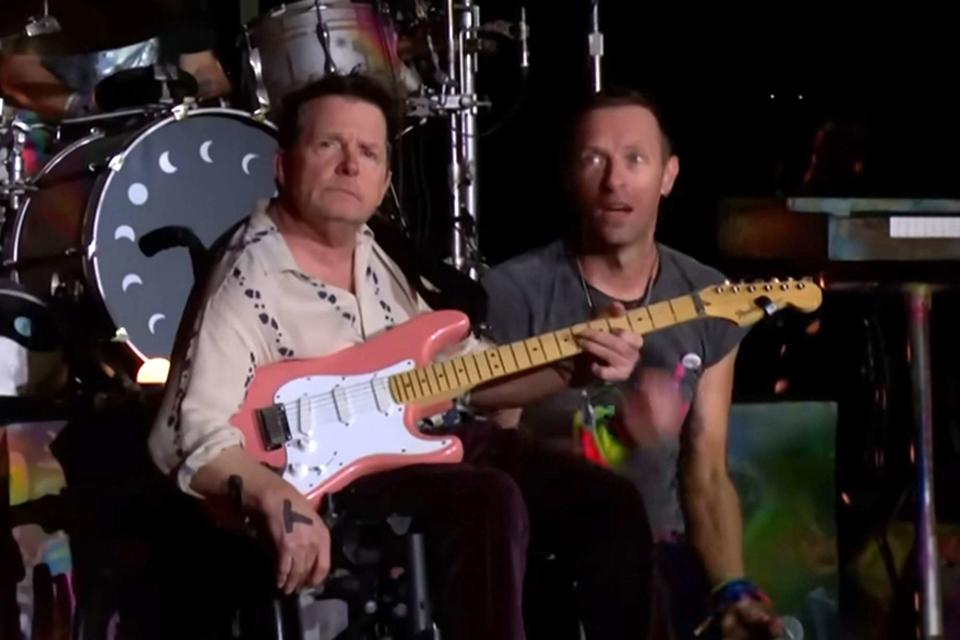 <p>BBC Music/YouTube</p> Michael J. Fox and Coldplay frontman Chris Martin at the Glastonbury Festival.